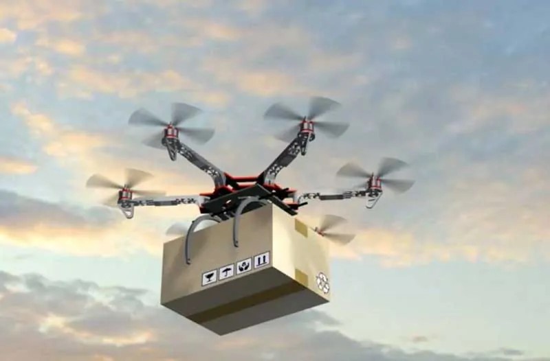 Flying drone lifting cardboard box