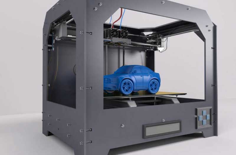 3D printer with small blue car inside