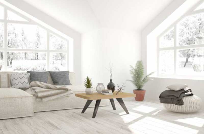 Bright living room with a wooden table at the centre