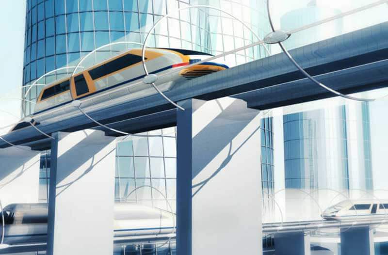 a futuristic train travelling on elevated rails