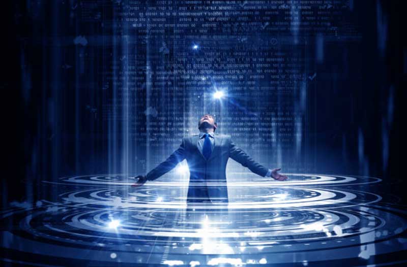 A man in a suit with arms spread looking up and surrounded with circular digital interfaces