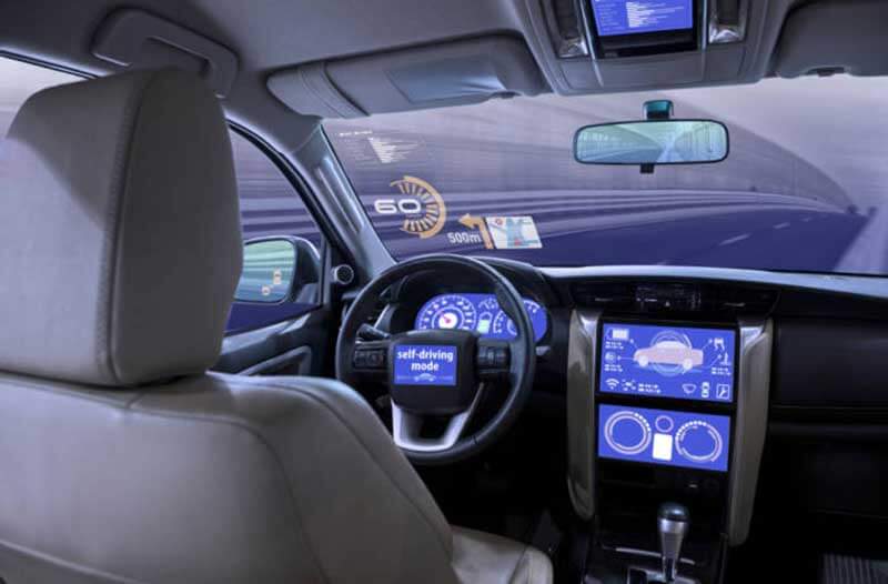 The cabin of a self-driving car with a holographic speedometer