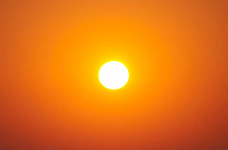The sun in an orange sky