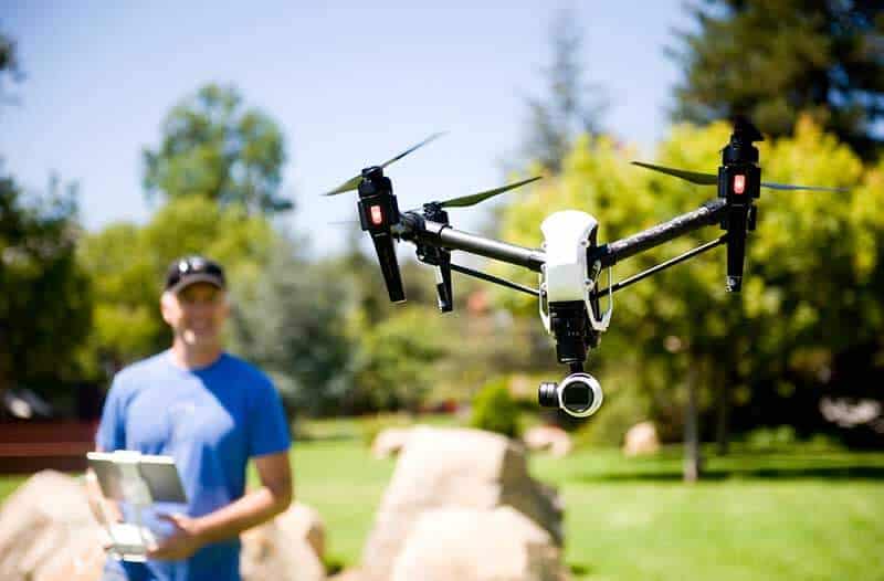 Man outside controlling a drone