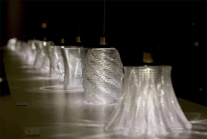Transparent 3D-printed glass structures placed in a line
