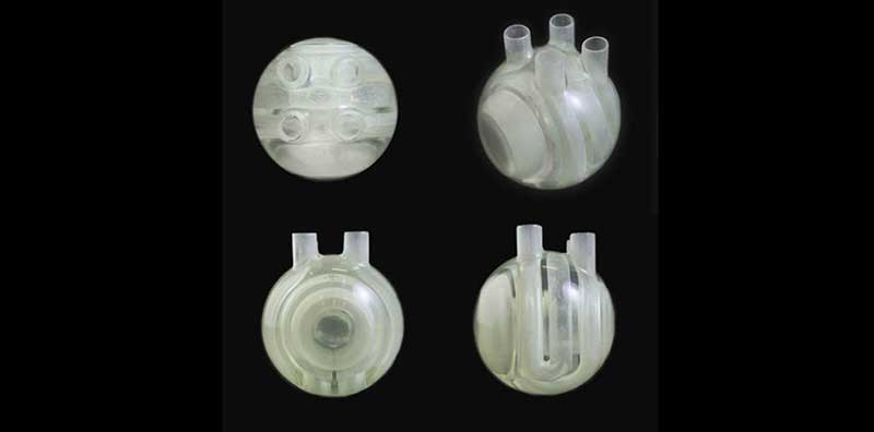 Four photos of a circular artificial heart