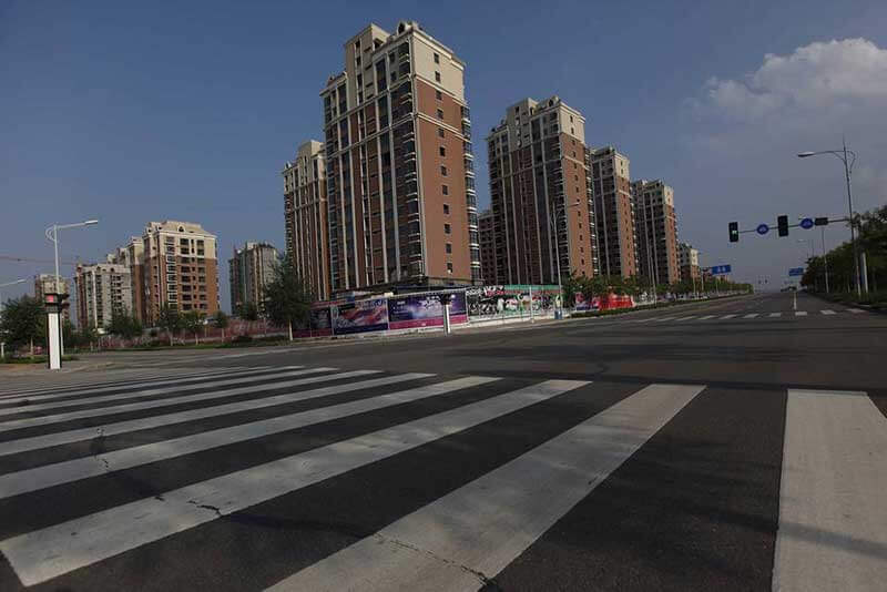 Zebra crossing and empty high-rise buildings