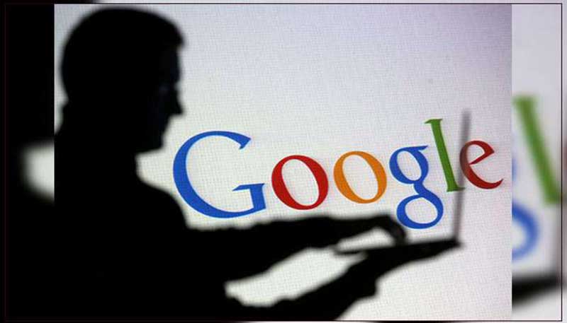 Silhouette of a man holding a laptop, with the Google logo in the background