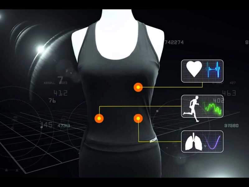Black smart shirt with graphs and floating numbers showing heart rate, muscle strain, and breathing capacity