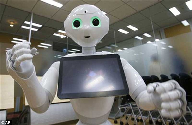 A white humanoid robot with a screen attached to its chest