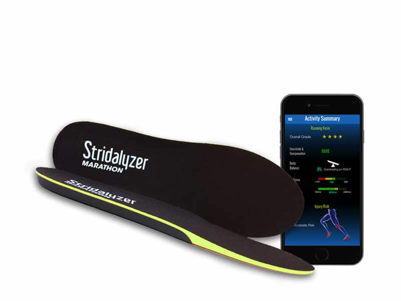 Smart insoles next to a smartphone with “activity summary” displayed on its screen