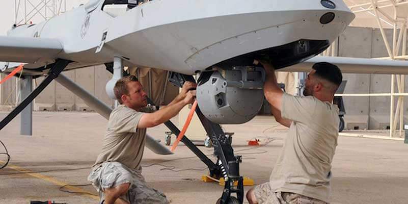 Engineers repairing an airplane
