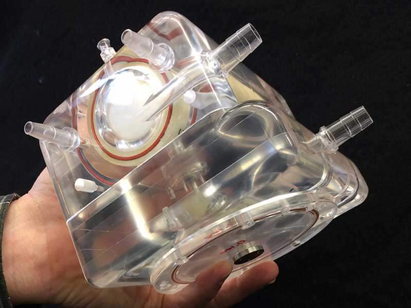  A hand holding a square-shaped artificial lung