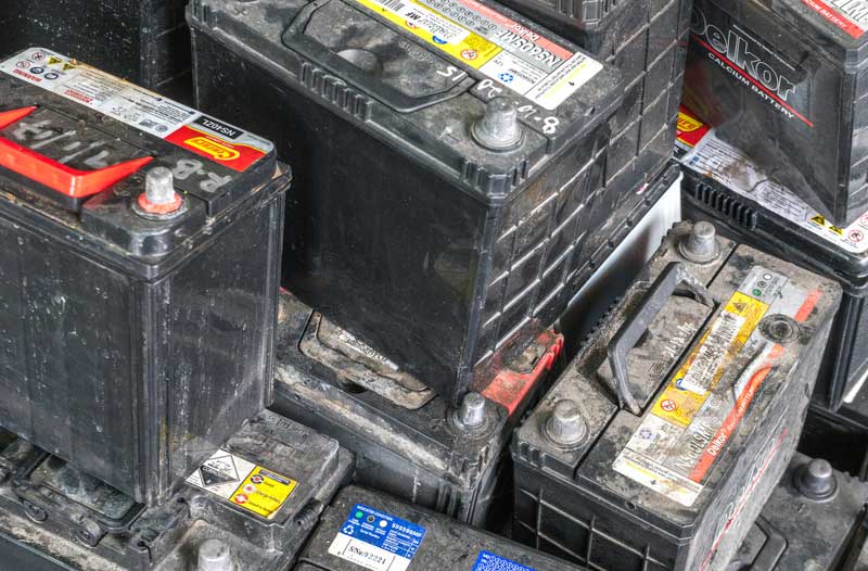 Stacks of used car batteries
