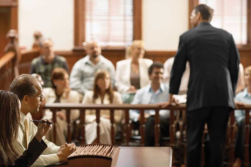 A courtroom with the jury blurred in the background