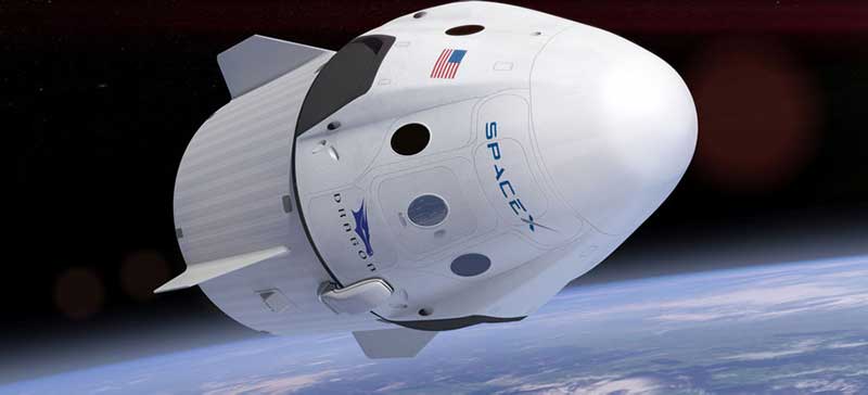  SpaceX Dragon Crew capsule floating in space above Earth