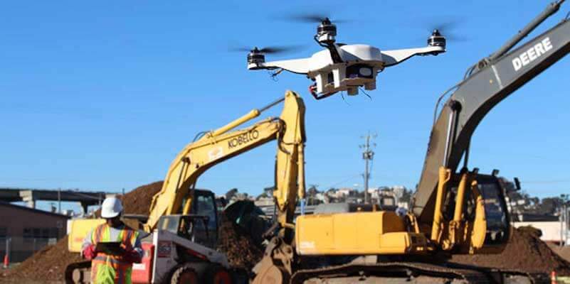 Construction site with excavating machines and a drone