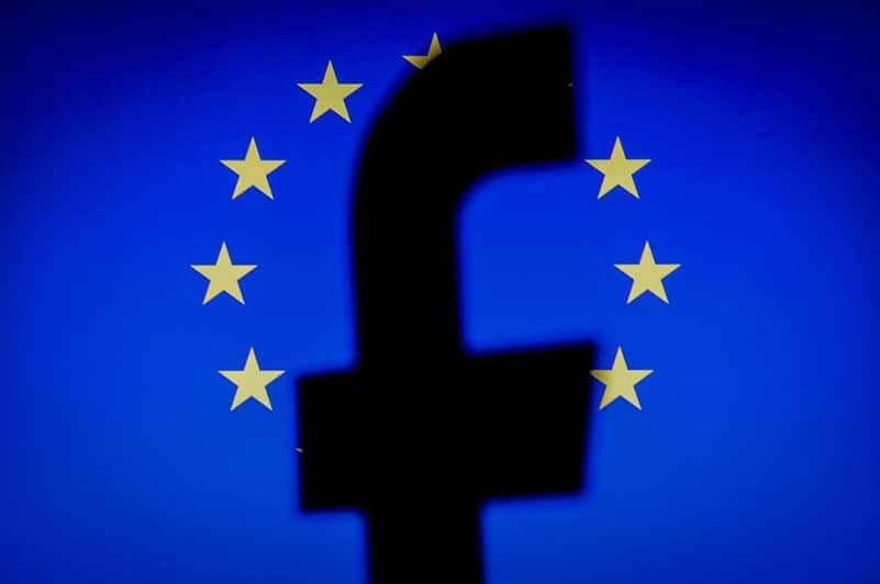  Silhouette of Facebook’s logo with a European Union flag in the background