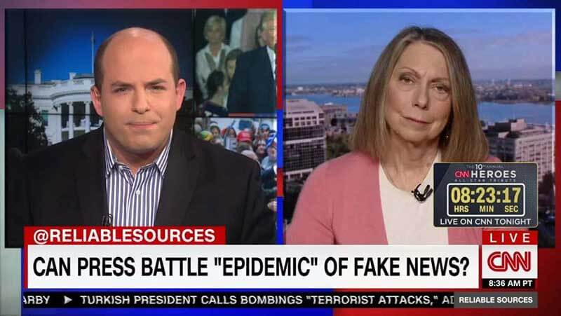 A screenshot of CNN Live where a man and a woman discuss fake news