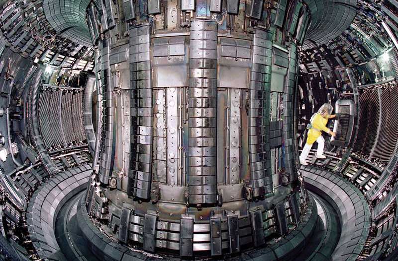 Man in yellow suit inside a fusion reactor