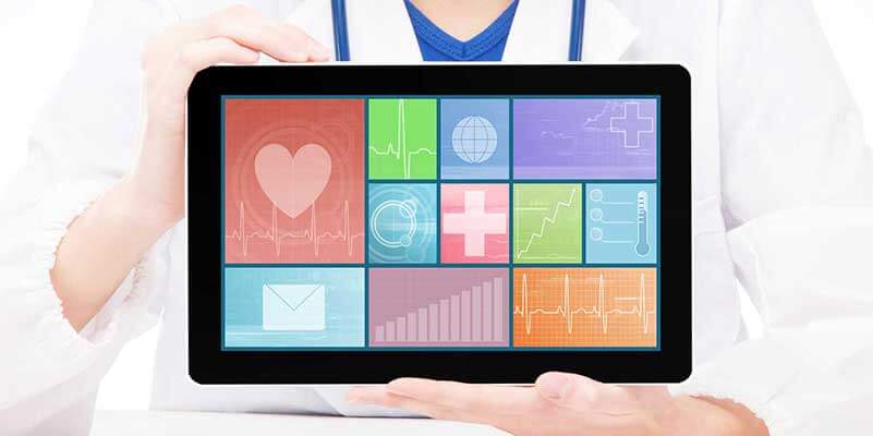 Doctor holding tablet with medical icons