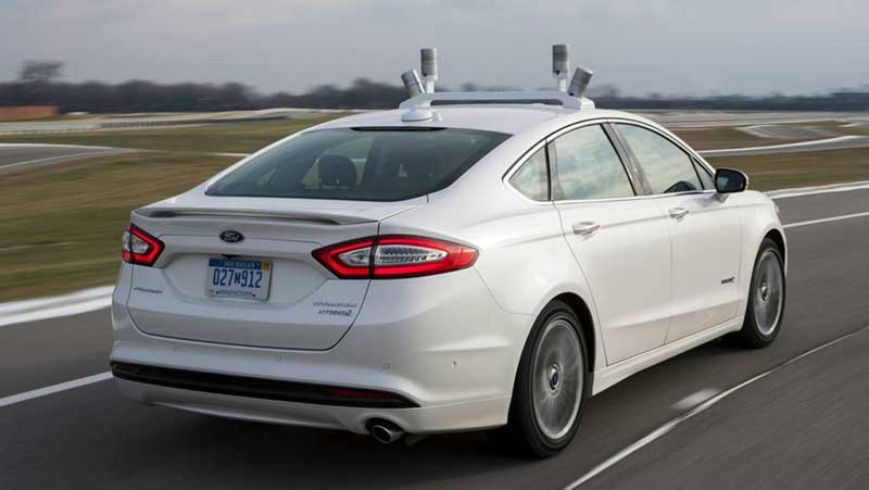 White Ford Fusion with a lidar system on top