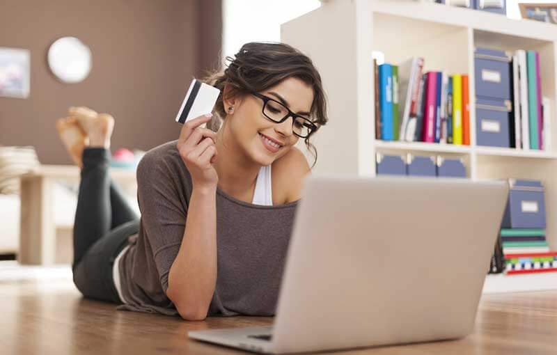 Girl with laptop and credit card