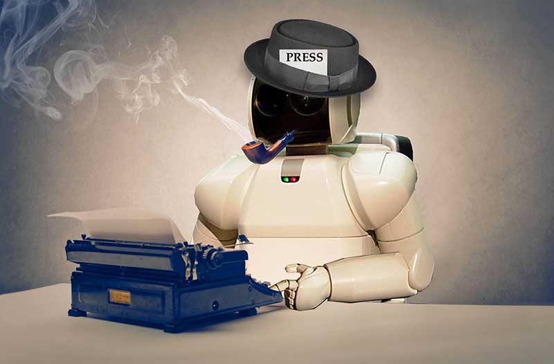 A white robot wearing a black hat with a label with the word ‘press’ and a pipe sitting at a desk with a typewriter