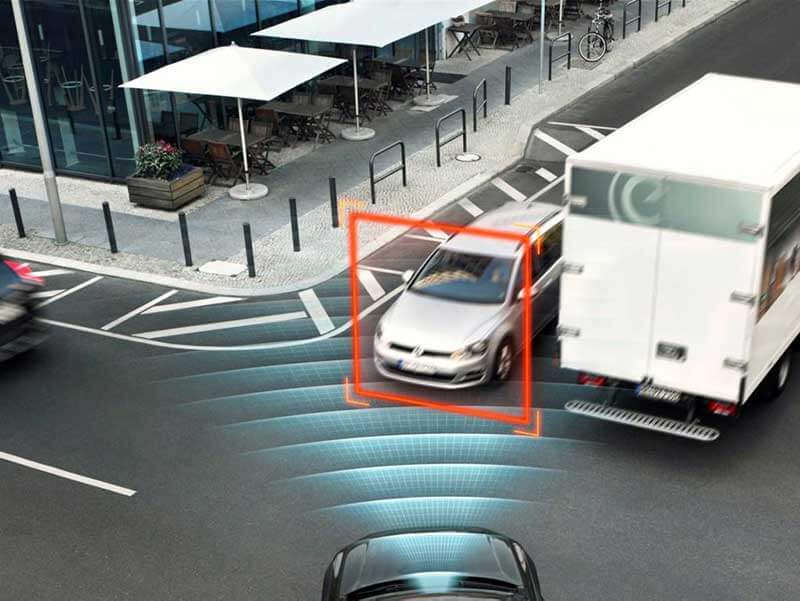  Road intersection showing a front side of an autonomous car