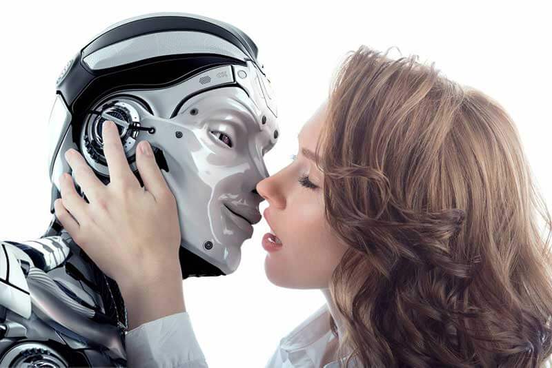 A woman leaning in to kiss a robot