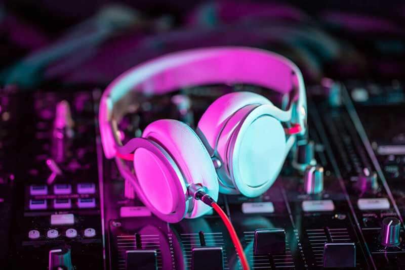 White headphones placed on a soundboard