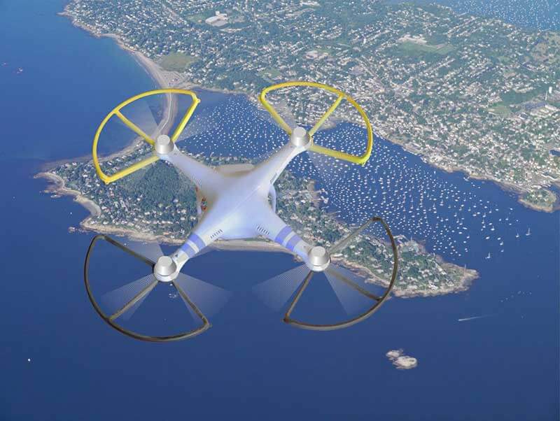  Four-arm drone flying over a harbour and its surrounding area