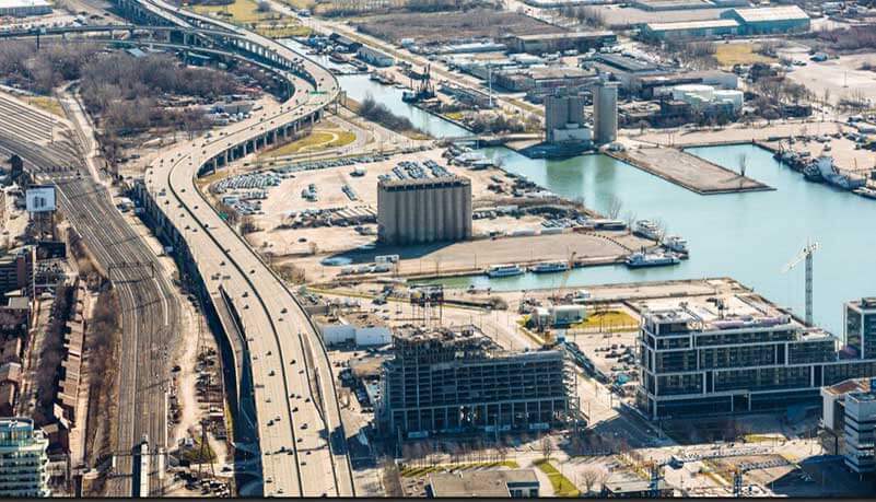 A construction site on a waterfront photographed from above