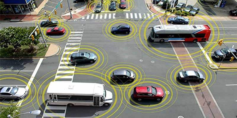 Intersection with buses and cars and digital information